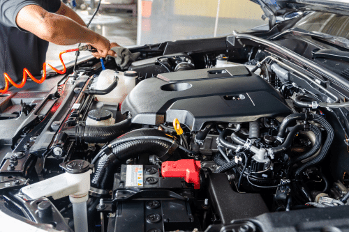 Auto repair shop for european vehicles in Parkton, NC. with Brian's Motor Werks. Image of european car engine being cleaned by a menchanic in shop.